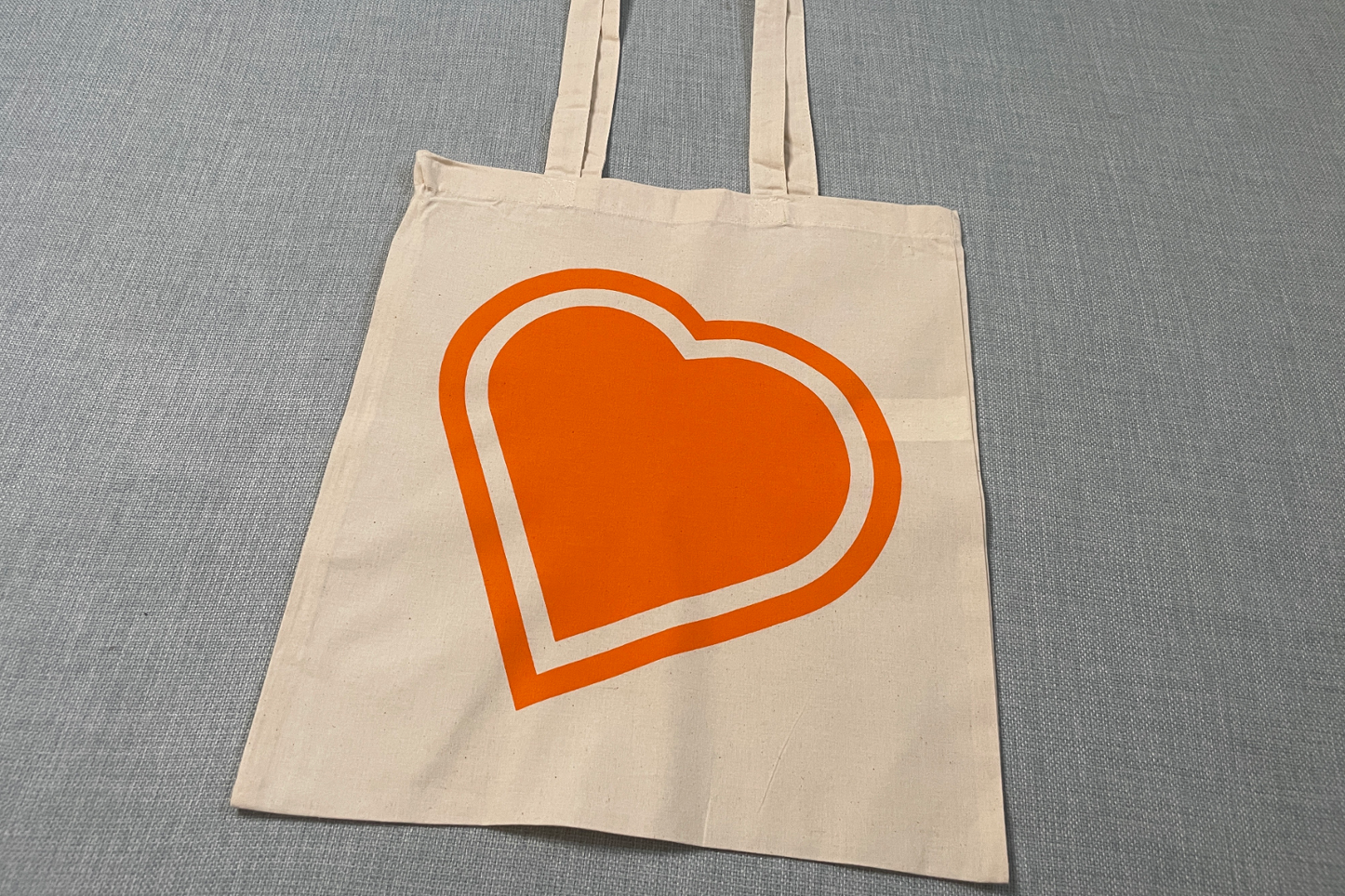 A Bounceback Food CIC Tote Bag with Orange heart