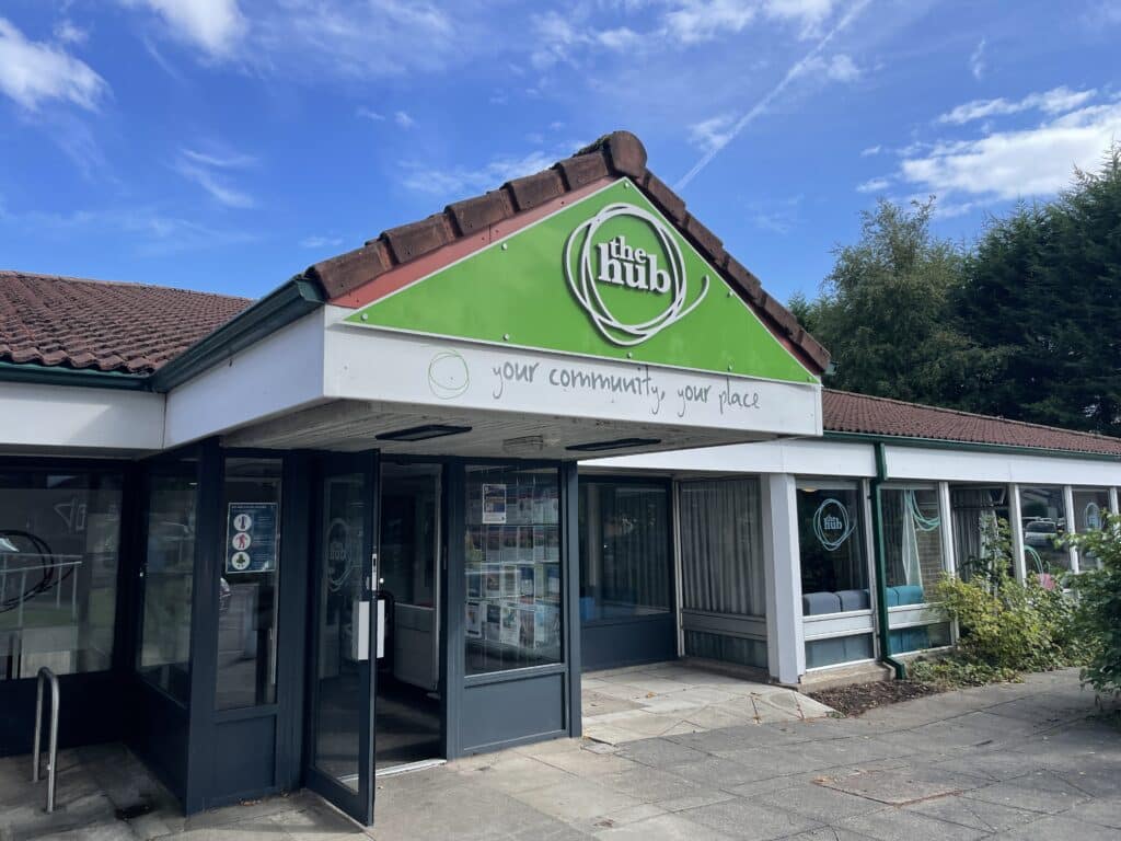 The Hub community centre in Altrincham from the outside on a sunny day