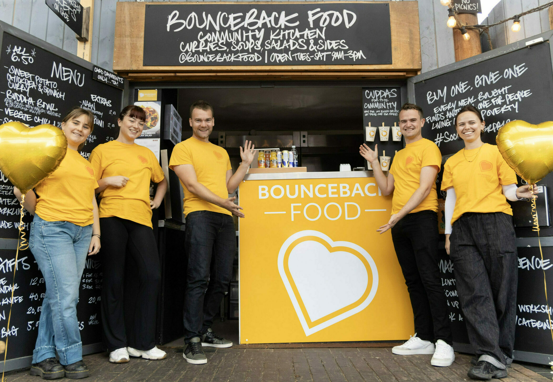The Bounceback Food team in Manchester stood outside the new Community Kitchen at Altrincham Market.